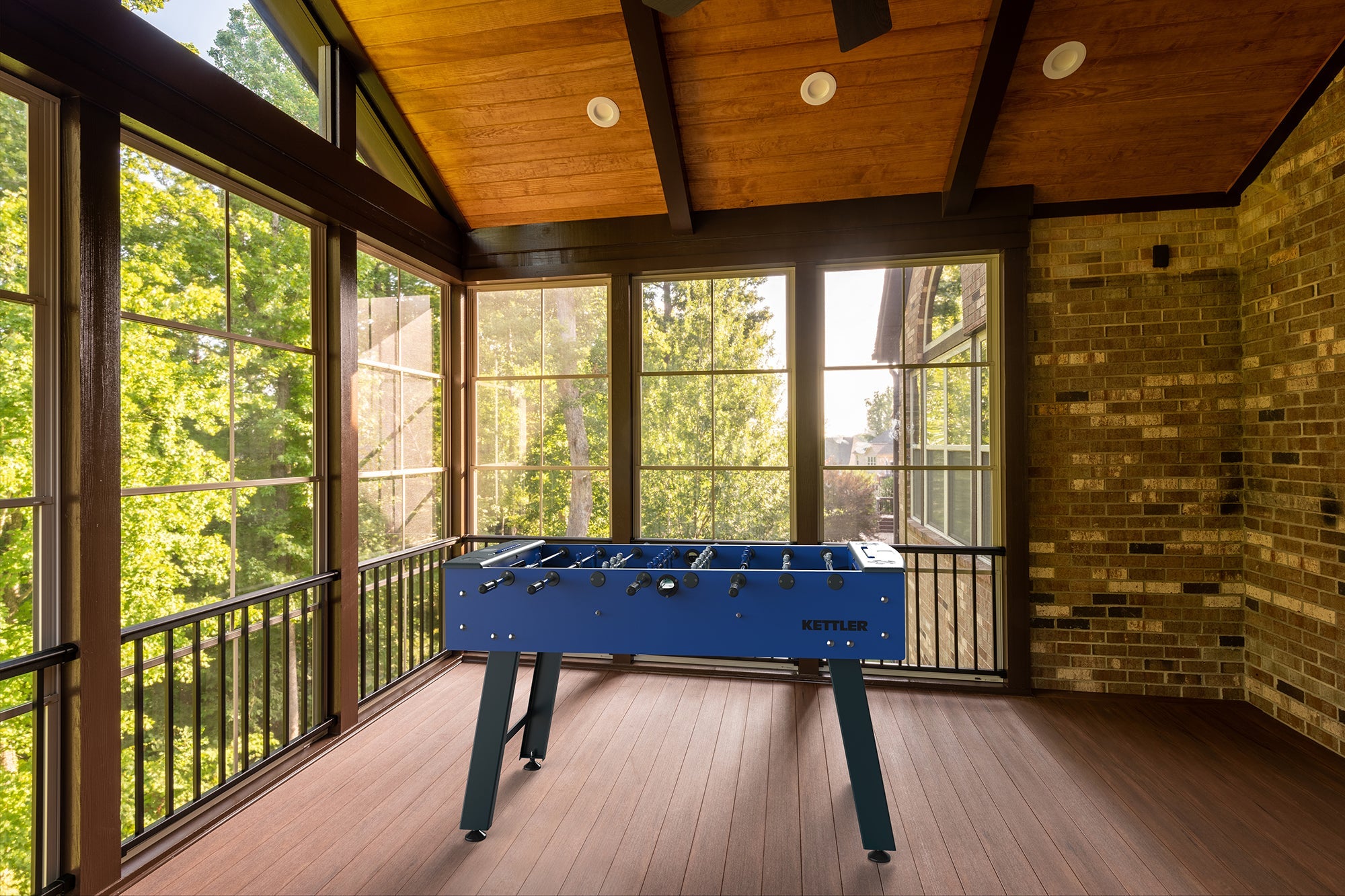 lifestyle shot of foosball table in sun room